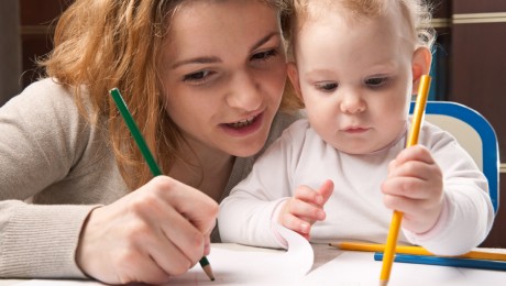 mother and baby writing