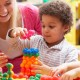 child care worker building blocks